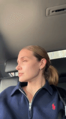 Woman photographs herself inside vehicle in Tbilisi