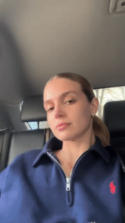 Woman photographs herself inside vehicle in Tbilisi