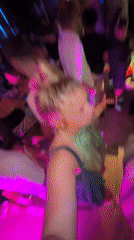 Evening social gathering documented at neon-lit Nha Trang bar