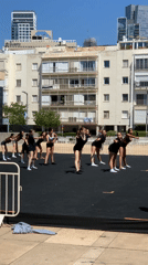 Dance group rehearses synchronized routine in Tel Aviv square