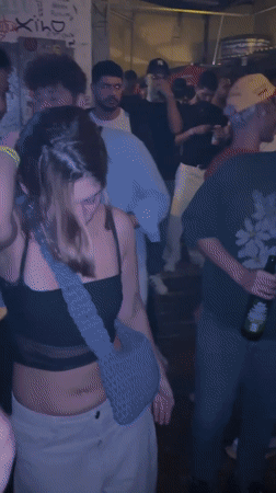 Woman dancing at São Paulo nightclub venue early morning