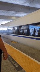 On board a bullet train, rolling through city and countryside