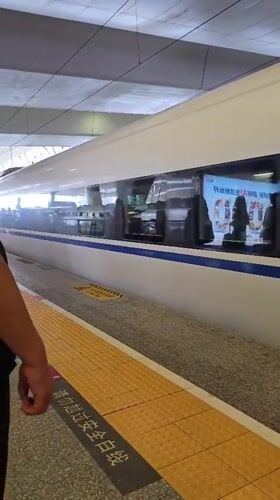 On board a bullet train, rolling through city and countryside