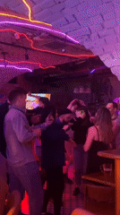 Dancing captured at neon-lit Saratov bar Friday evening