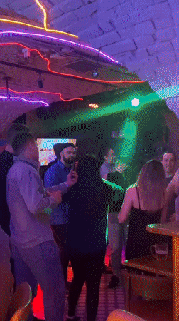 Dancing captured at neon-lit Saratov bar Friday evening