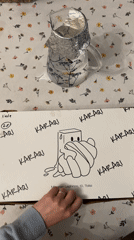 Customer opens KARAQI pastry box in Tbilisi