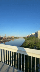 Cyclist crosses bridge in Tyumen during early morning hours