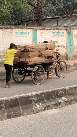 Daily street life unfolds in Dhaka neighborhood