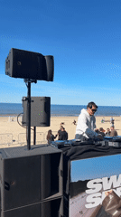 DJ performs beach set in sunny Jūrmala, Latvia
