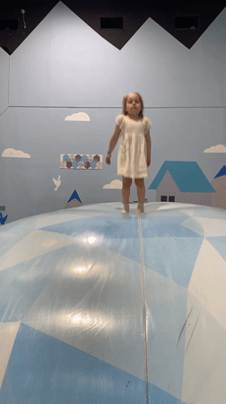 Children play on indoor inflatable structure in Izhevsk