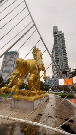 Golden horse statue monument observed in Nha Trang traffic roundabout
