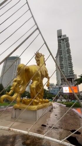 Golden horse statue monument observed in Nha Trang traffic roundabout