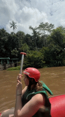 Early morning whitewater rafting expedition captured in Bali jungle