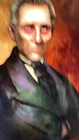 This is a close-up, medium-angle video of a portrait of an older, pale-skinned man with gray hair slicked back. He wears a dark suit with a white collared shirt and a black tie. The man has deeply sunken cheeks, prominent cheekbones, and stark white skin. His eyes are sunken and appear red around the irises. The background of the portrait is a textured, mottled gold and brown, suggesting an antique painting. The video features subtle camera movements, zooming in and out slightly and panning slightly to the left and right, creating a subtle animation effect on the static portrait. The lighting appears dramatic, with strong shadows emphasizing the contours of the man's face. The overall impression is one of a gothic or horror-themed artistic rendering.