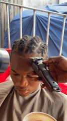 Onitsha barbershop serves customers during afternoon hours
