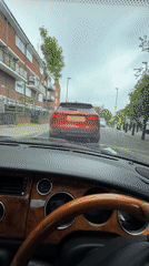 Luxury car driver with distinctive style captured in London
