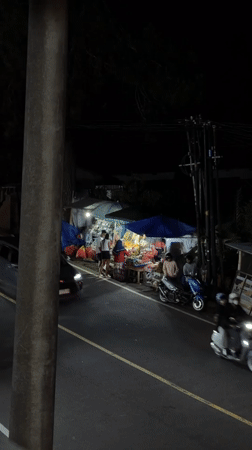 Evening dining and vendor activities documented in Baturiti, Indonesia