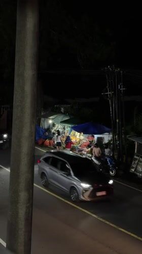 Evening dining and vendor activities documented in Baturiti, Indonesia