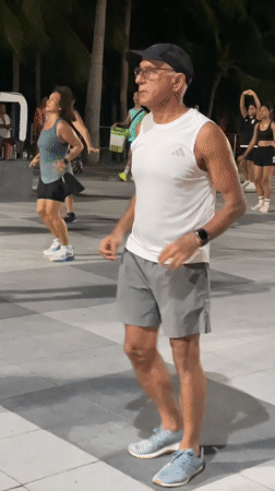 Colorful outdoor dance fitness session along Pattaya's waterfront promenade