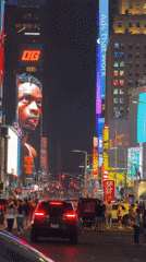 Times Square digital billboard displays 'OG' message at night