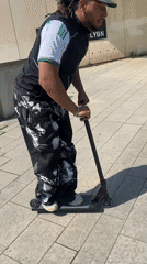 Man rides scooter in outdoor Lyon area