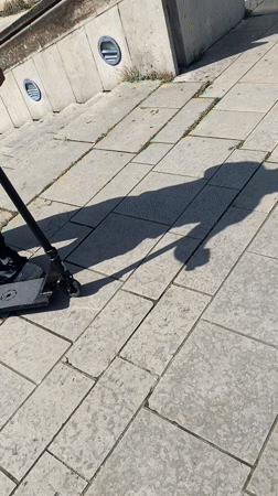 Man rides scooter in outdoor Lyon area