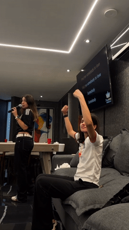 Indoor gathering in Puebla with karaoke and matching green kits