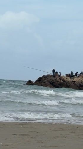 Morning beach activities captured at Kiryat Yam Mediterranean shore