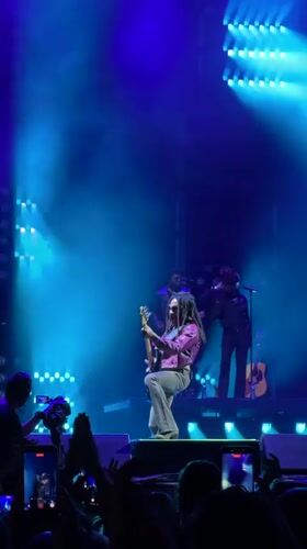 Live concert in Belgrade: guitarist with dreadlocks rocks the stage