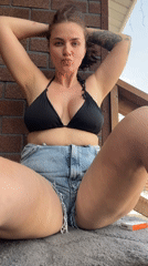 Woman photographed in casual poses on Moscow deck