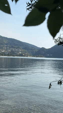 Yellow seaplane and alpine lake views in northern Italy
