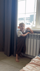 Two children photographed playing indoors in Эстачи, Russia