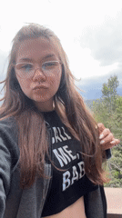 Tourist films selfie video at scenic Taormina overlook
