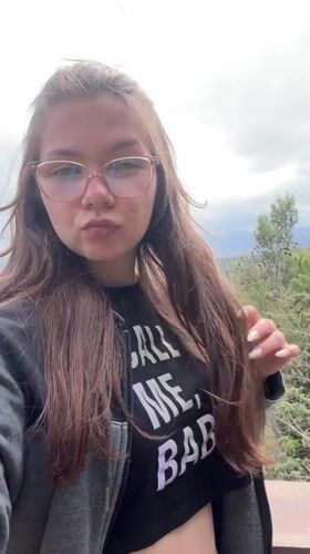 Tourist films selfie video at scenic Taormina overlook