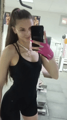 Woman Takes Mirror Selfie in Gym Workout Attire
