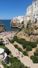 Lama Monachile beach in full summer swing, Polignano a Mare