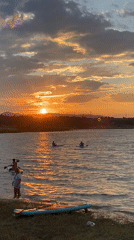 Paddleboarding on a Tbilisi lake at golden hour