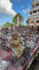 Weathered Buddha statues displayed outdoors in Thailand