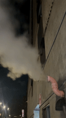 Montreal evening scenes: building vapor and subway commuter