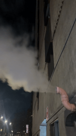 Montreal evening scenes: building vapor and subway commuter