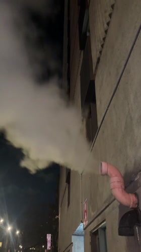 Montreal evening scenes: building vapor and subway commuter
