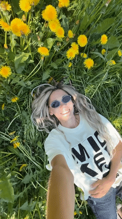 Mother and child enjoy spring morning in Russian dandelion field