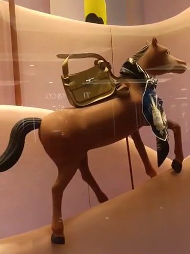 Shopper documents luxury retail displays across Dubai mall levels