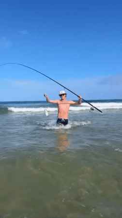 Early morning fishing success and beach socializing at Bulli