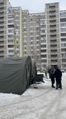 Humanitarian aid tents operate in snowy Kyiv residential area