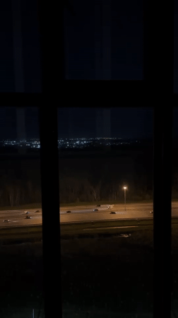 Night cityscape viewed through window in Novosergievka, Russia