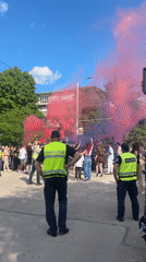 Police monitor street gathering with smoke in Ruse, Bulgaria