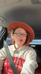 Woman in feathered hat, period costume observed in Yekaterinburg car