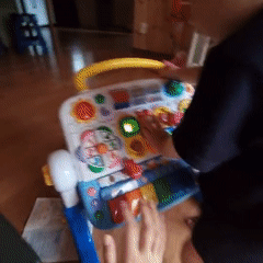 Toddler's music toy playtime shared as a social challenge