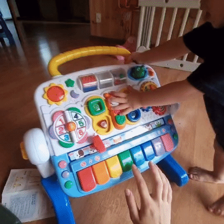 Toddler's music toy playtime shared as a social challenge